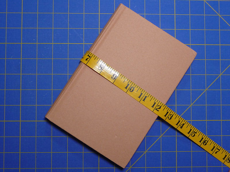 A book with a tape measure